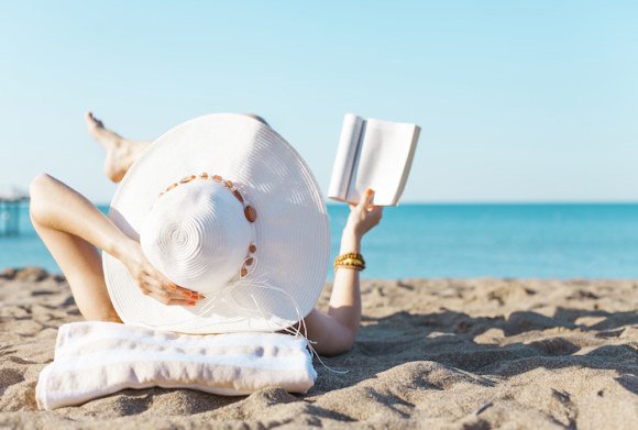 relaxing with a book on the beach